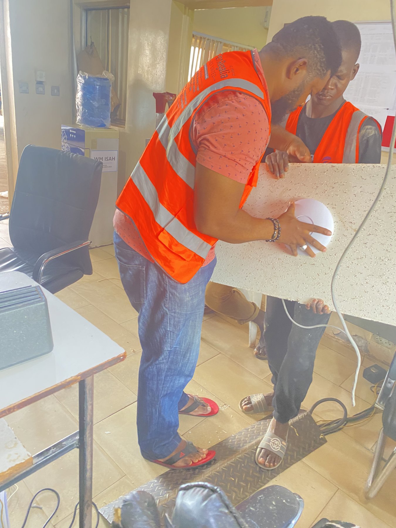 Hands-on installation of wireless networking equipment.